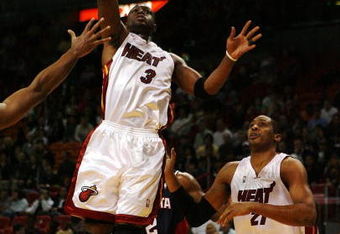 MIAMI - DECEMBER 12:  Dwyane Wade #3 of the Miami Heat scores against the Atlanta Hawks at American Airlines Arena on December 12, 2008 in Miami, Florida. NOTE TO USER: User expressly acknowledges and agrees that, by downloading and/or using this Photograph, user is consenting to the terms and conditions of the Getty Images License Agreement.  (Photo by Doug Benc/Getty Images)