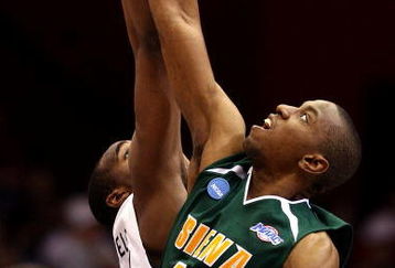 DAYTON, OH - MARCH 22: Alex Franklin #42 of the Siena Saints and Samardo Samuels #24 of the Louisville Cardinals go up for the opening tip-off during the second round of the NCAA Division I Men's Basketball Tournament at the University of Dayton Arena on March 22, 2009 in Dayton, Ohio.  (Photo by Andy Lyons/Getty Images)