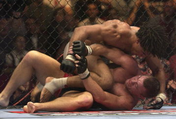 LONDON - JULY 13:  Carlos Newton of Canada battles with Matt Hughes of the USA during the Ultimate Fighting Championship, 'Brawl in the Royal Albert Hall', in the Royal Albert Hall London, England on July 13, 2002. (Photo by John Gichigi/Getty Images)