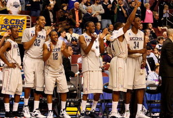 PHILADELPHIA - MARCH 21:  Kemba Walker #15, Jonathan Mandeldove #32, A.J. Price #12,  Stanley Robinson #21, Jeff Adrien #4 and Hasheem Thabeet #34 of the Connecticut Huskies show camaraderie for their team during the game against the Texas A&M Aggies during the second round of the NCAA Division I Men's Basketball Tournament at the Wachovia Center on March 21, 2009 in Philadelphia, Pennsylvania.  The Huskies defeated the Aggies 92-66.  (Photo by Jim McIsaac/Getty Images)