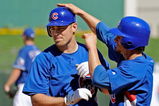 SURPRISE, AZ - FEBRUARY 27:  Micah Hoffpauir #6 (L) of the Chicago Cubs is congratulated by teammate Ryan Theriot #2 who scored on Hoffpauir's two-run home run against the Texas Rangers during a spring training game at the Surprise Stadium on February 27, 2009 in Surprise, Arizona.  (Photo by Kevork Djansezian/Getty Images)