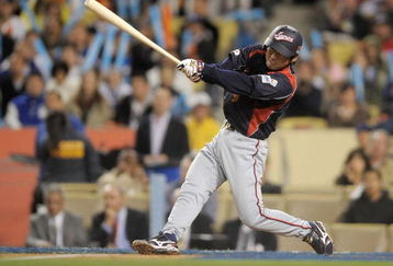 LOS ANGELES, CA - MARCH 23:  Michihiro Ogasawara #9 of Japan hits a RBI single in the third inning of the finals of the 2009 World Baseball Classic against Korea on March 23, 2009 at Dodger Stadium in Los Angeles, California.  (Photo by Kevork Djansezian/Getty Images)