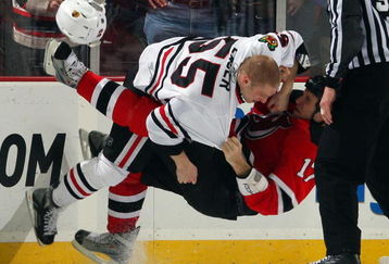 NEWARK, NJ - MARCH 17:  Ben Eager #55 of the Chicago Blackhawks takes down Mike Rupp #17 of the New Jersey Devils during their fight at the Prudential Center on March 17, 2009 in Newark, New Jersey.  (Photo by Jim McIsaac/Getty Images)