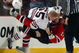 NEWARK, NJ - MARCH 17:  Ben Eager #55 of the Chicago Blackhawks takes down Mike Rupp #17 of the New Jersey Devils during their fight at the Prudential Center on March 17, 2009 in Newark, New Jersey.  (Photo by Jim McIsaac/Getty Images)