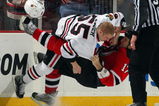NEWARK, NJ - MARCH 17:  Ben Eager #55 of the Chicago Blackhawks takes down Mike Rupp #17 of the New Jersey Devils during their fight at the Prudential Center on March 17, 2009 in Newark, New Jersey.  (Photo by Jim McIsaac/Getty Images)