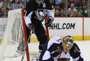 PITTSBURGH - MARCH 17: Evgeni Malkin #71 of the Pittsburgh Penguins is backed into by Johan Hedberg #1 of the Atlanta Thrashers at the Mellon Arena March 17, 2009 in Pittsburgh, Pennsylvania. The Penguins defeated the Thrashers 6-2. (Photo by Bruce Bennett/Getty Images)