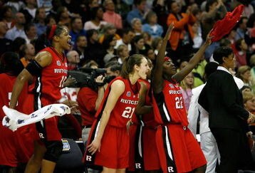 CLEVELAND - APRIL 01: (L-R) Kia Vaughn #15, Heather Zurich #21 and Matee Ajavon #22 of the Rutgers Scarlet Knights celebrate from the bench late inthe game against the LSU Lady Tigers during the National Semifinal game of the 2007 NCAA Women's Final Four at the Quicken Loans Arena on April 1, 2007 in Cleveland, Ohio. Rutgers won 59-35. (Photo by Gregory Shamus/Getty Images)
