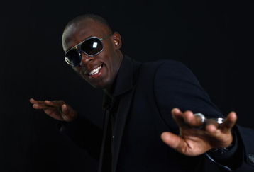 MONTE CARLO, MONACO - NOVEMBER 23:  Usain Bolt of Jamaica strikes a pose after receiving the Men's World Athlete of the Year Award during the IAAF World Athletics Gala at the Hotel on November 23, 2008 in Monte Carlo, Monaco.  (Photo by Julian Finney/Getty Images)