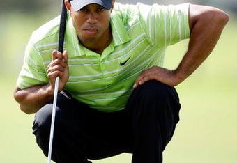 DORAL, FL - MARCH 14:  Tiger Woods lines up a putt on the 2nd hole during the third round of the World Golf Championships-CA Championship on March 14, 2009 at the Doral Golf Resort and Spa in Doral, Florida.  (Photo by Jamie Squire/Getty Images)