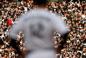 CHICAGO - OCTOBER 05:  A.J. Pierzynski #12 of the Chicago White Sox stands on first base as fans cheer in the background after Pierzynski hit a RBI single in the bottom of the third inning against the Tampa Bay Rays in Game Three of the ALDS during the 2008 MLB Playoffs at U.S. Cellular Field on October 5, 2008 in Chicago, Illinois.  (Photo by Jamie Squire/Getty Images)
