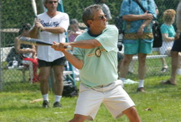 EAST HAMPTON, NY - AUGUST 16: Writer Mike Lupica at bat at the 2003 Artists & Writers Softball Game August 16, 2003  in East Hampton, New York.   (Photo by Matthew Peyton/Getty Images)