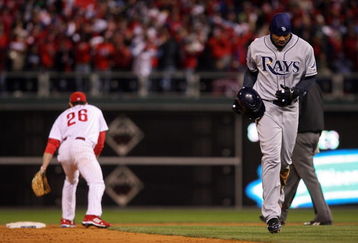 PHILADELPHIA - OCTOBER 29:  Carl Crawford #13 of the Tampa Bay Rays walks back to the dugout after he was forced out at second base on a double play ball hit by B.J. Upton in the top of the eight inning against the Philadelphia Phillies during the continuation of game five of the 2008 MLB World Series on October 29, 2008 at Citizens Bank Park in Philadelphia, Pennsylvania.  (Photo by Doug Pensinger/Getty Images)