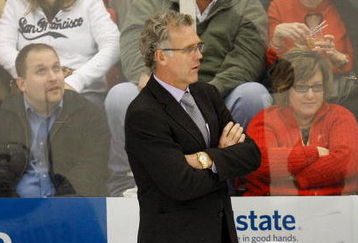 DETROIT - NOVEMBER 17:  Head Coach Craig MacTavish of the Edmonton Oilers looks on with his players Marc-Antoine Pouliot #78 and Kyle Brodzkiak #51 from the bench area during their NHL game against the Detroit Red Wings on November 17, 2008 at Joe Louis Arena in Detroit, Michigan. The Red Wings defeated the Oilters 4-0. (Photo by Gregory Shamus/Getty Images)