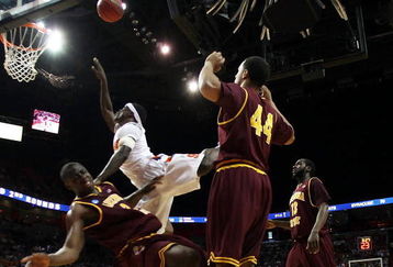 MIAMI - MARCH 22:  Center Eric Boateng #2 of the Arizona State Sun Devils is knocked to the ground by guard Jonny Flynn #10 of the Syracuse Orange as he tries to score during the second round of the NCAA Division I Men's Basketball Tournament at the American Airlines Arena on March 22, 2009 in Miami, Florida.  (Photo by Marc Serota/Getty Images)
