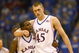 LAWRENCE, KANSAS - JANUARY 3:  Sherron Collins #4 and Cole Aldrich #45 of the Kansas Jayhawks walk on court against the Tennessee Volunteers on January 3, 2009 at Allen Fieldhouse in Lawrence, Kansas. (Photo by: Jamie Squire/Getty Images)