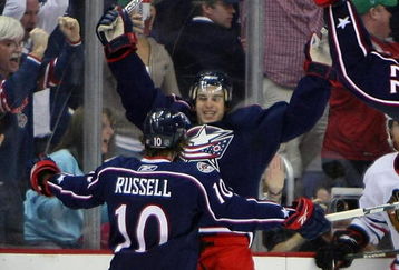 COLUMBUS, OH - MARCH 18: Kris Russell #10 of the Columbus Blue Jackets greets teammate Antoine Vermette #50 who scored in overtime to defeat the Chicago Blackhawks 4-3 at the Nationwide Arena March 18, 2009 in Columbus, Ohio. (Photo by Bruce Bennett/Getty Images)