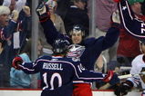 COLUMBUS, OH - MARCH 18: Kris Russell #10 of the Columbus Blue Jackets greets teammate Antoine Vermette #50 who scored in overtime to defeat the Chicago Blackhawks 4-3 at the Nationwide Arena March 18, 2009 in Columbus, Ohio. (Photo by Bruce Bennett/Getty Images)
