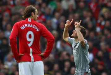 MANCHESTER, UNITED KINGDOM - MARCH 14:  Fabio Aurelio of Liverpool celebrates scoring his team's third goal as Dimitar Berbatov of Manchester United looks on during the Barclays Premier League match between Manchester United and Liverpool at Old Trafford on March 14, 2009 in Manchester, England.  (Photo by Laurence Griffiths/Getty Images)