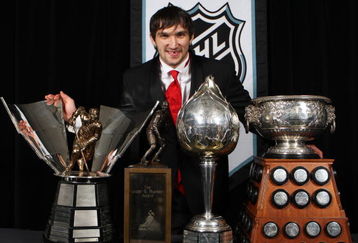 TORONTO, ON - JUNE 12:  Alexander Ovechkin of the Washington Capitals poses with the Hart Memorial Trophy, the Lester B. Pearson Award, the Art Ross Trophy, and the Maurice 'Rocket' Richard Trophy during the 2008 NHL Awards at the Elgin Theatre on June 12, 2008 in Toronto, Canada. ( Photo by Claus Andersen/Getty Images)