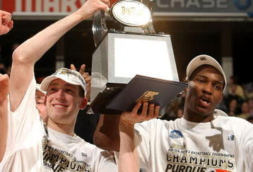 INDIANAPOLIS - MARCH 15:  (L-R) Tournamnet Most Outstanding Player Robbie Hummel #4 and JaJuan Johnson #25 of the Purdue Boilermakers celebrate with the Big Ten tournamnet championship trophy after their 65-61 win against the Ohio State Buckeyes during the final of the Big Ten Men's Basketball Tournament at Conseco Fieldhouse on March 15, 2009 in Indianapolis, Indiana.  (Photo by Jonathan Daniel/Getty Images)