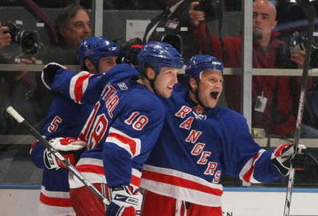 NEW YORK - MARCH 15: Sean Avery #16 (R) of the New York Rangers celebrates his second goal of the game against the Philadelphia Flyers and is joined by Dan Girardi #5 (L) and Marc Staal #18 (C) on March 15, 2009 at Madison Square Garden in New York City. The Rangers defetaed the Flyers 4-1. (Photo by Bruce Bennett/Getty Images)