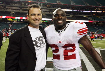 ATLANTA - OCTOBER 15:  Agent Drew Rosenhaus  poses with Reuben Droughns #22 of the New York Giants after the game against the Atlanta Falcons at Georgia Dome on October 15, 2007 in Atlanta, Georgia. The Giants defeated the Falcons 31-10 for their fourth straight win after opening the season 0-2.  (Photo by Doug Benc/Getty Images)