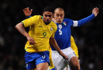 LONDON - FEBRUARY 10:  Fabio Cannavaro of Italy challenges Adriano of Brazil during the International Friendly match between Brazil and Italy at the Emirates Stadium on February 10, 2009 in London, England.  (Photo by Shaun Botterill/Getty Images)