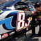BRISTOL, TN - MARCH 22: Brian Vickers, driver of the #83 Red Bull Toyota, prepares to climb into his car prior to the NASCAR Sprint Cup Series Food City 500 at Bristol Motor Speedway on March 22, 2009 in Bristol, Tennessee.  (Photo by Geoff Burke/Getty Images for NASCAR)