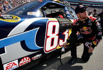BRISTOL, TN - MARCH 22: Brian Vickers, driver of the #83 Red Bull Toyota, prepares to climb into his car prior to the NASCAR Sprint Cup Series Food City 500 at Bristol Motor Speedway on March 22, 2009 in Bristol, Tennessee.  (Photo by Geoff Burke/Getty Images for NASCAR)