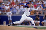 ARLINGTON, TX - 1990s:  Nolan Ryan #34 of the Texas Rangers pitches during a circa 1990s game at Arlington Stadium in Arlington, Texas. Ryan pitched for the Rangers from 1989-93.  (Photo by Jonathan Daniel/Getty Images)