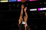 LOS ANGELES - MARCH 17:  Andre Iguodala #9 of the the Philadelphia 76ers makes a three point basket at the final buzzer over Trevor Ariza #3 of the Los Angeles Lakers to win the game on March 17, 2009 at Staples Center in Los Angeles, California.  he 76ers won 94-93.   NOTE TO USER: User expressly acknowledges and agrees that, by downloading and/or using this Photograph, user is consenting to the terms and conditions of the Getty Images License Agreement. (Photo by Stephen Dunn/Getty Images)