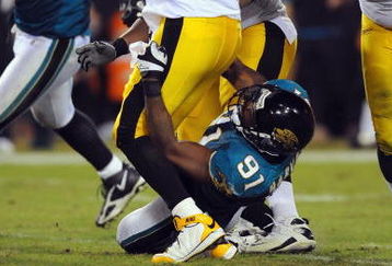 JACKSONVILLE, FL - OCTOBER 05:  Quarterback Ben Roethlisberger #7 of the Pittsburgh Steelers is sacked by Derrick Harvey #91 of the Jacksonville Jaguars at Jacksonville Municipal Stadium on October 5, 2008 in Jacksonville, Florida.  (Photo by Sam Greenwood/Getty Images)