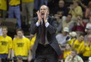 14 Nov 2001:  Head coach Dennis Wolff of Boston University yells instructions to his team as they play Iowa at the Guardians Classic in Iowa City Iowa. DIGITAL IMAGE Mandatory Credit: Jonathan Daniel/ALLSPORT