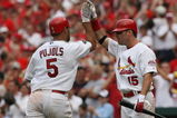 ST. LOUIS, MO - JUNE 8: Jim Edmonds #15 of the St. Louis Cardinals congratulates teammate Albert Pujols #5 after Pujols knocked in three runs against the Milwaukee Brewers at Busch Stadium July 29, 2007 in St. Louis, Missouri.  The Cardinals beat the Brewers 9-5.  (Photo by Dilip Vishwanat/Getty Images)