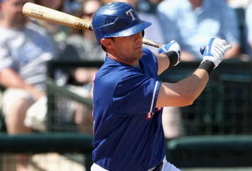 SURPRISE, AZ - MARCH 04:  Michael Young #10 of the Texas Rangers hits an RBI single against the Kansas City Royals during the first inning of the spring training game at Surprise Stadium on March 4, 2009 in Surprise, Arizona.  (Photo by Christian Petersen/Getty Images)