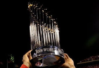 PHILADELPHIA - OCTOBER 29:  Jimmy Rollins #11 of the Philadelphia Phillies celebrates with the World Series Championship trophy after their 4-3 win against the Tampa Bay Rays during the continuation of game five of the 2008 MLB World Series on October 29, 2008 at Citizens Bank Park in Philadelphia, Pennsylvania.  (Photo by Pool/Getty Images)