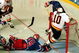 11 Jun 1994: PAVEL BURE HANGS ON THE CROSS BAR TO AVOID DIVING RANGERS GOALTENDER MIKE RICHTER DURING THE FIRST PERIOD OF GAME SIX OF THE STANLEY CUP FINALS IN VANCOUVER, BRITISH COLUMBIA.