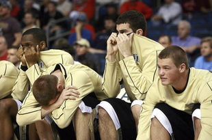 TAMPA, FL - MARCH 08: The Wake Forest Demon Deacons' bench reacts as the game goes into double over-time against the Georgia Tech Yellow Jackets in the opening round of the ACC Men's Basketball Tournament at the St. Pete Times Forum on March 8, 2007 in Tampa, Florida. (Photo by Doug Benc/Getty Images)