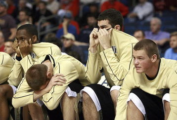 TAMPA, FL - MARCH 08:  The Wake Forest Demon Deacons' bench reacts as the game goes into double over-time against the Georgia Tech Yellow Jackets in the opening round of the ACC Men's Basketball Tournament at the St. Pete Times Forum on March 8, 2007 in Tampa, Florida. (Photo by Doug Benc/Getty Images)