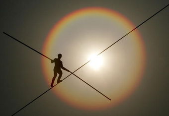 SEOUL, SOUTH KOREA - MAY 04:  Bekhzod Tashkenbaev of Uzbekistan participates in the first World High Wire Championships, over the HanGang River, on May 3, 2007 in Seoul, South Korea. As part of the Hi Seoul Festival 2007 programme, 18 world famous high-wire walkers from the Americas, Europe and Asia will compete in the championships in which contestants have to negotiate a 30mm-thick iron wire stretching 1,000m across the HanGang River in the fastest possible time. (Photo by Chung Sung-Jun/Getty Images)