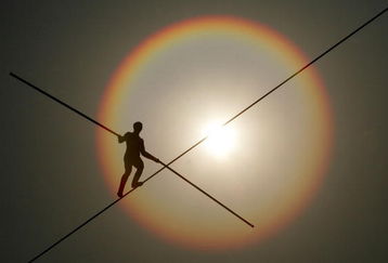 SEOUL, SOUTH KOREA - MAY 04:  Bekhzod Tashkenbaev of Uzbekistan participates in the first World High Wire Championships, over the HanGang River, on May 3, 2007 in Seoul, South Korea. As part of the Hi Seoul Festival 2007 programme, 18 world famous high-wire walkers from the Americas, Europe and Asia will compete in the championships in which contestants have to negotiate a 30mm-thick iron wire stretching 1,000m across the HanGang River in the fastest possible time. (Photo by Chung Sung-Jun/Getty Images)