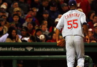 BOSTON - OCTOBER 13:  Starting pitcher Fausto Carmona #55 of the Cleveland Indians runs off the field after getting pulled from the game in the fifth inning against the Boston Red Sox during Game Two of the American League Championship Series at Fenway Park on October 13, 2007 in Boston, Massachusetts.  (Photo by Jim Rogash/Getty Images)