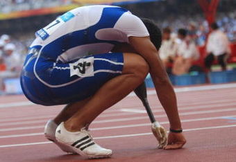 BEIJING - SEPTEMBER 15   Arnaud Assoumani of France lies exhausted after running in the men's 100M final athletics event at the National Stadium during day nine of the 2008 Paralympic Games on September 15, 2008 in Beijing, China. (photo by Chien-min Chung/Getty Images)