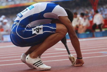 BEIJING - SEPTEMBER 15   Arnaud Assoumani of France lies exhausted after running in the men's 100M final athletics event at the National Stadium during day nine of the 2008 Paralympic Games on September 15, 2008 in Beijing, China. (photo by Chien-min Chung/Getty Images)