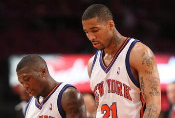 NEW YORK - MARCH 20:  Nate Robinson #4 of the New York Knicks walks from the court with teammate Wilson Chandler #21 against the Sacramento Kingson March 20, 2009 at Madison Square Garden in New York City. NOTE TO USER: User expressly acknowledges and agrees that, by downloading and or using this photograph, User is consenting to the terms and conditions of the Getty Images License Agreement.  (Photo by Nick Laham/Getty Images)
