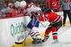 NEWARK, NJ - JANUARY 02: John Madden #11 of the New Jersey Devils defends against Tom Kostopoulos #6 of the Montreal Canadiens on January 2, 2009 at the Prudential Center in Newark, New Jersey. (Photo by Bruce Bennett/Getty Images)