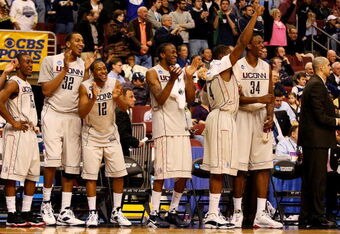 PHILADELPHIA - MARCH 21:  Kemba Walker #15, Jonathan Mandeldove #32, A.J. Price #12,  Stanley Robinson #21, Jeff Adrien #4 and Hasheem Thabeet #34 of the Connecticut Huskies show camaraderie for their team during the game against the Texas A&M Aggies during the second round of the NCAA Division I Men's Basketball Tournament at the Wachovia Center on March 21, 2009 in Philadelphia, Pennsylvania.  The Huskies defeated the Aggies 92-66.  (Photo by Jim McIsaac/Getty Images)