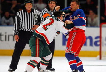 NEW YORK - MARCH 24:  Cal Clutterbuck #22 of the Minnesota Wild fights Sean Avery #16 of the New York Rangers during the first period at Madison Square Garden March 24, 2009 in New York City.  (Photo by Jim McIsaac/Getty Images)
