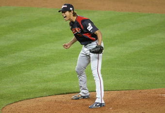 LOS ANGELES - MARCH 23:  Relief pitcher Yu Darvish #11 of Japan reacts after getting the final out against Korea during the finals of the 2009 World Baseball Classic on March 23, 2009 at Dodger Stadium in Los Angeles, California. (Photo by Stephen Dunn/Getty Images)