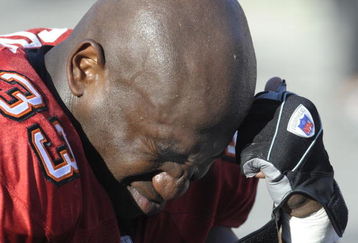 TAMPA, FL - DECEMBER 28: Fullback Jameel Cook #33 of the Tampa Bay Buccaneers ponders a failed playoff bid and an injury to running back Carnell Williams against the Oakland Raiders at Raymond James Stadium on December 28, 2008 in Tampa, Florida.  (Photo by Al Messerschmidt/Getty Images)